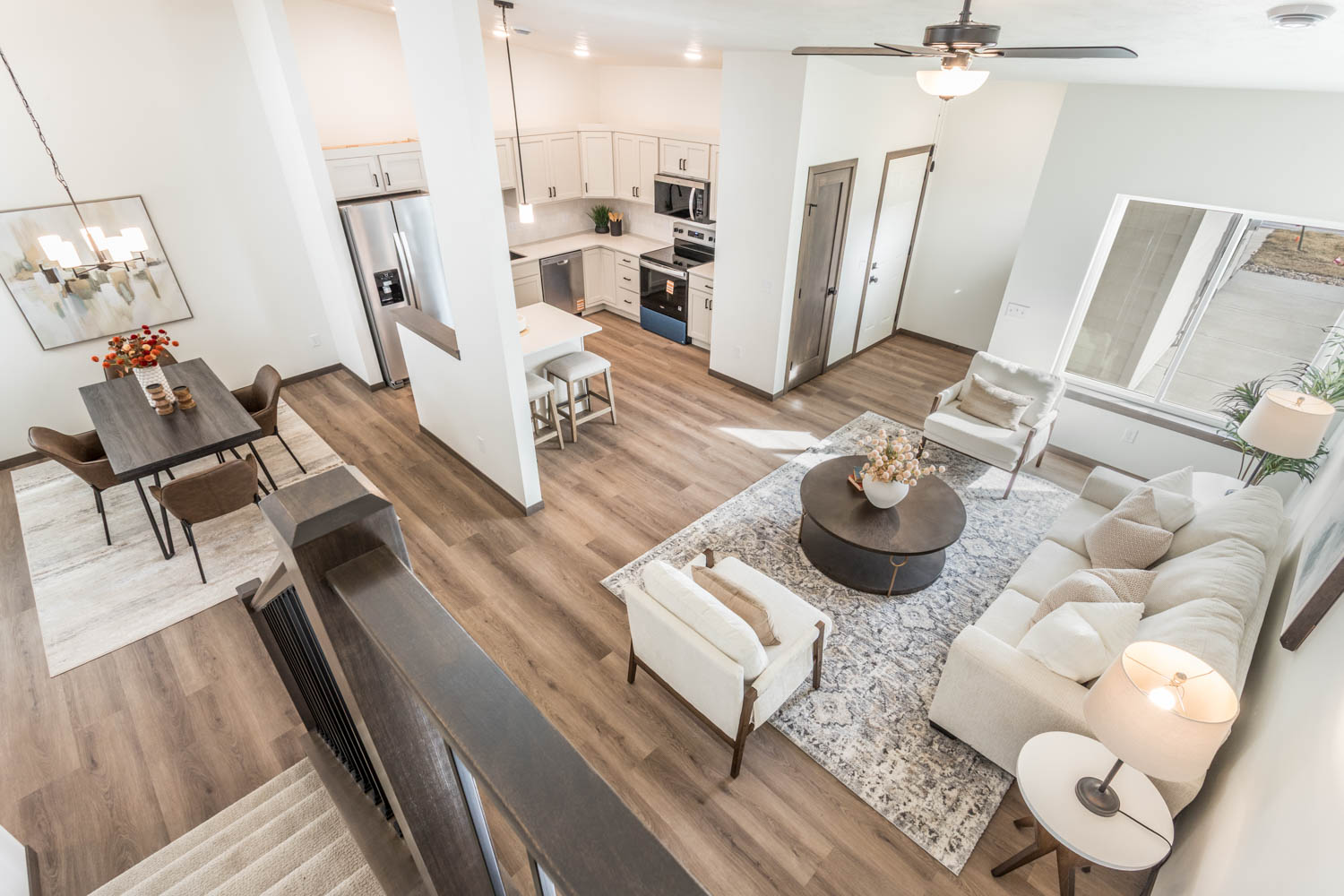 Open concept living, dining, and kitchen overview